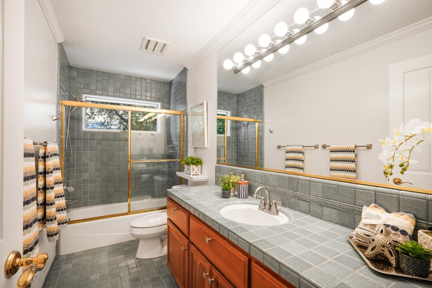 1245 Day Road Gilroy, CA 95020 - Photo 43 of 55 a bathroom with a sink a toilet and shower