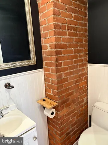 a bathroom with a toilet and a sink