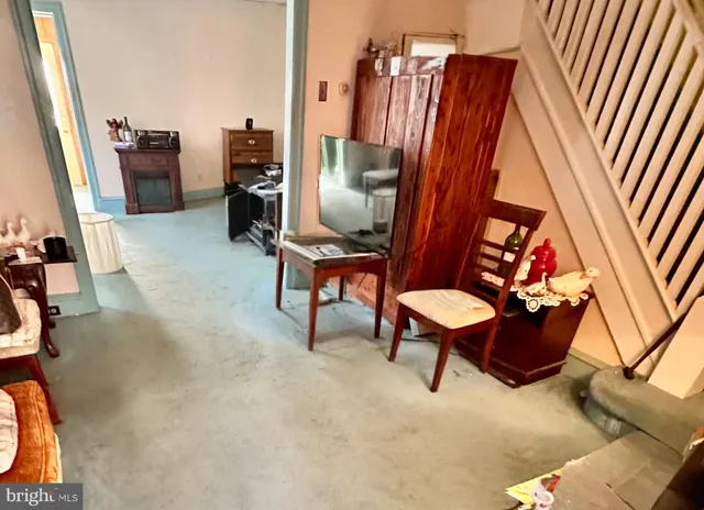 a room with furniture and a rug