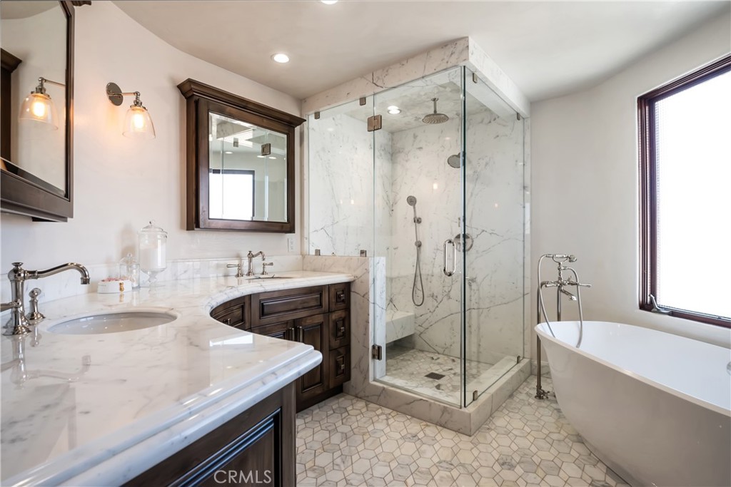 221 30th Street Manhattan Beach, CA 90266 - Photo 13 of 19 a spacious bathroom with a tub shower sink and mirror