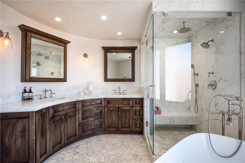 221 30th Street Manhattan Beach, CA 90266 - Photo 14 of 19 a spacious bathroom with a tub sink and mirror