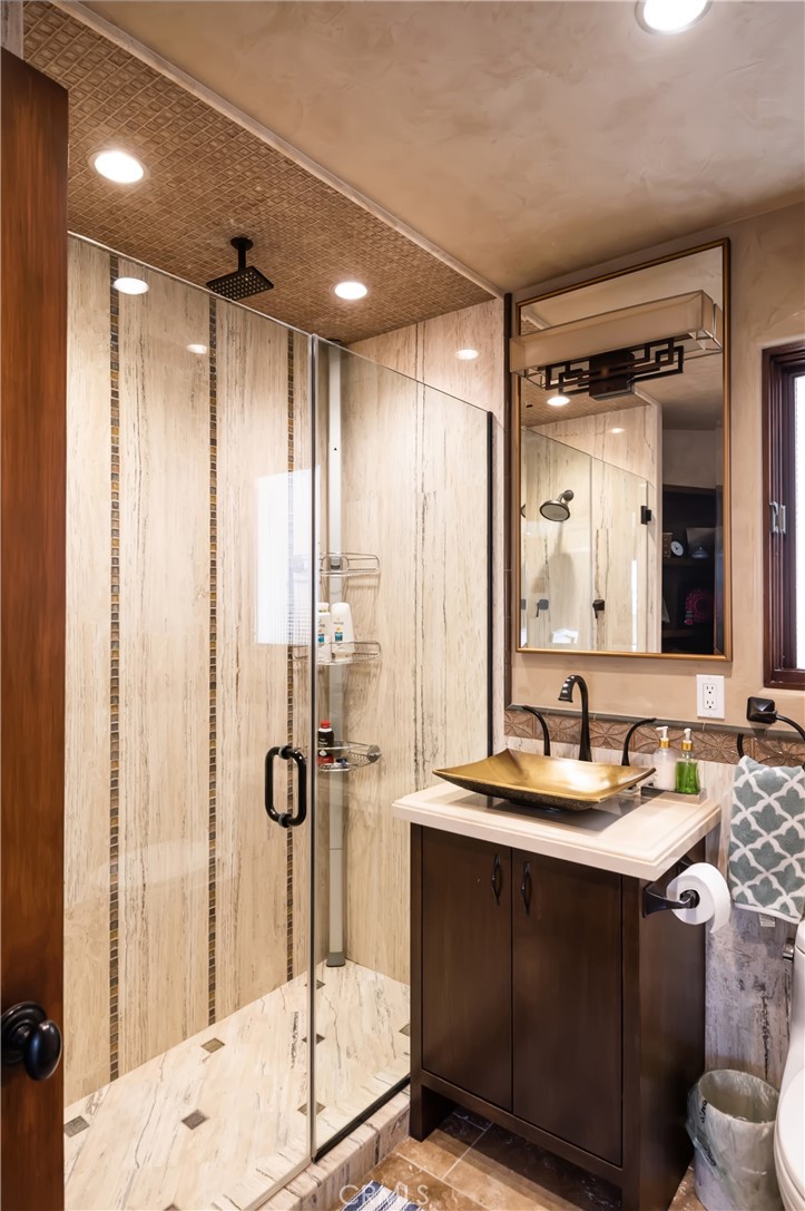 221 30th Street Manhattan Beach, CA 90266 - Photo 16 of 19 a bathroom with a double vanity sink mirror and shower
