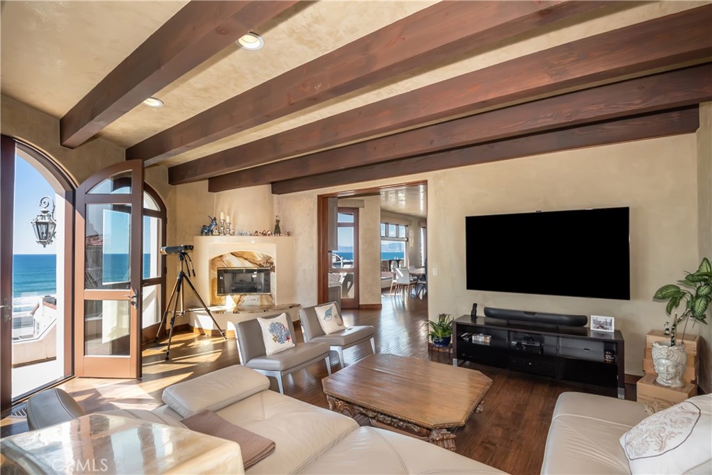 221 30th Street Manhattan Beach, CA 90266 - Photo 7 of 19 a living room with furniture and a flat screen tv