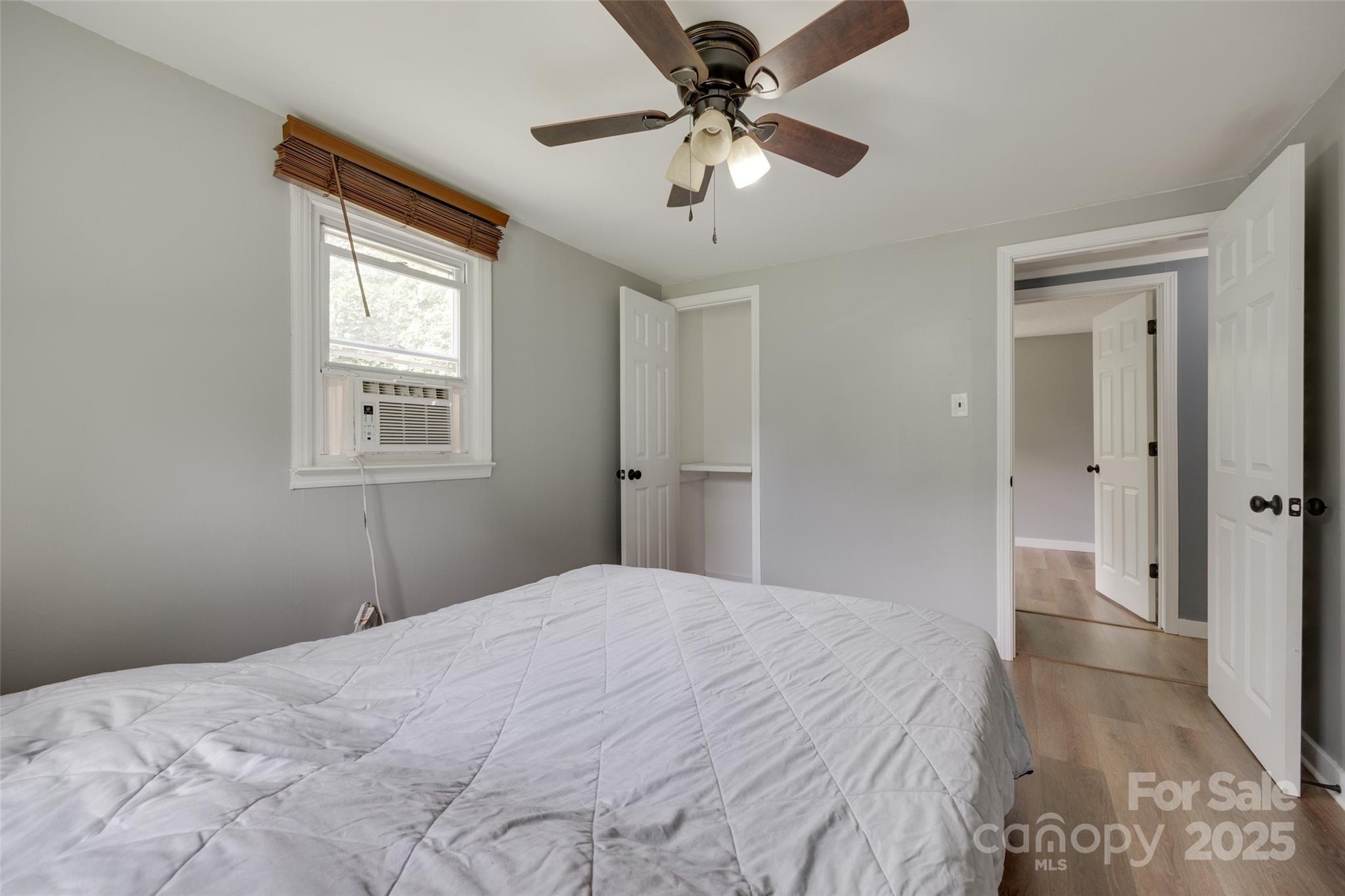 3083 State Rd S-11-54 Gaffney, SC 29340 - Photo 14 of 29 a bedroom with a large bed and a chandelier