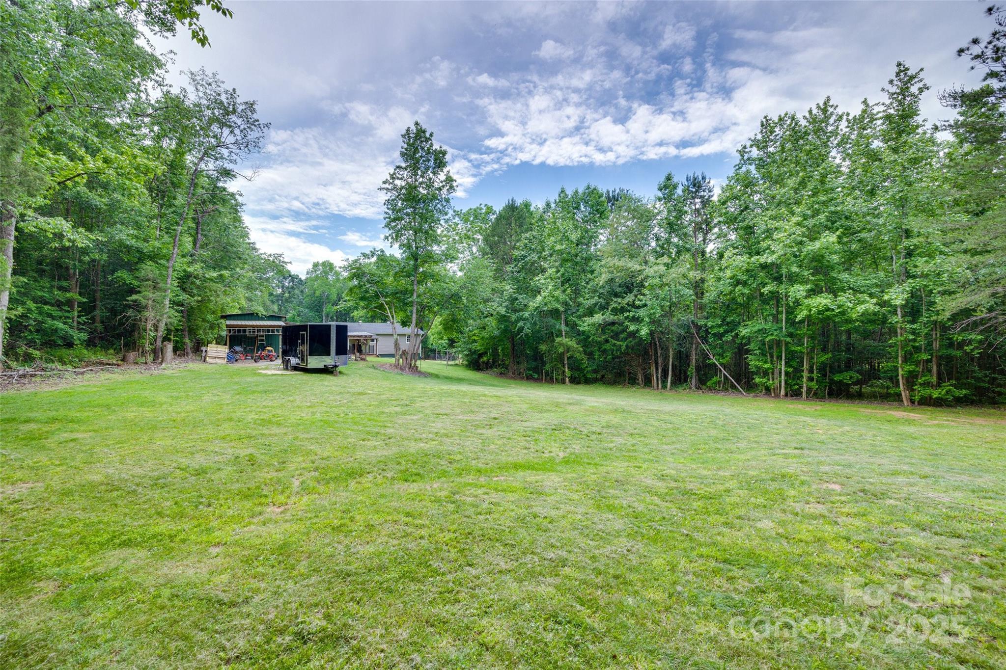 3083 State Rd S-11-54 Gaffney, SC 29340 - Photo 21 of 29 a view of a backyard with a garden