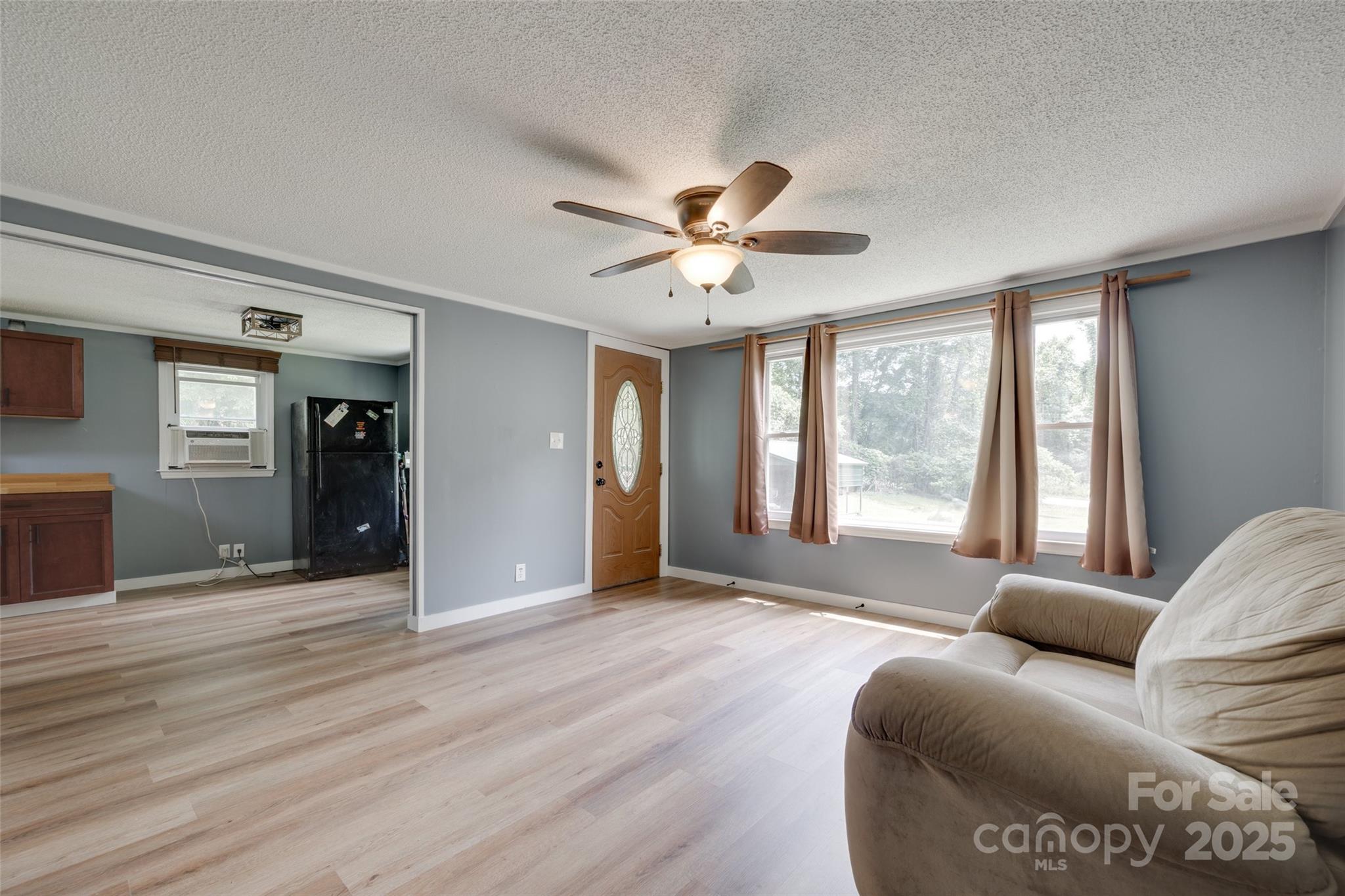 3083 State Rd S-11-54 Gaffney, SC 29340 - Photo 4 of 29 a living room with furniture and window with wooden floor
