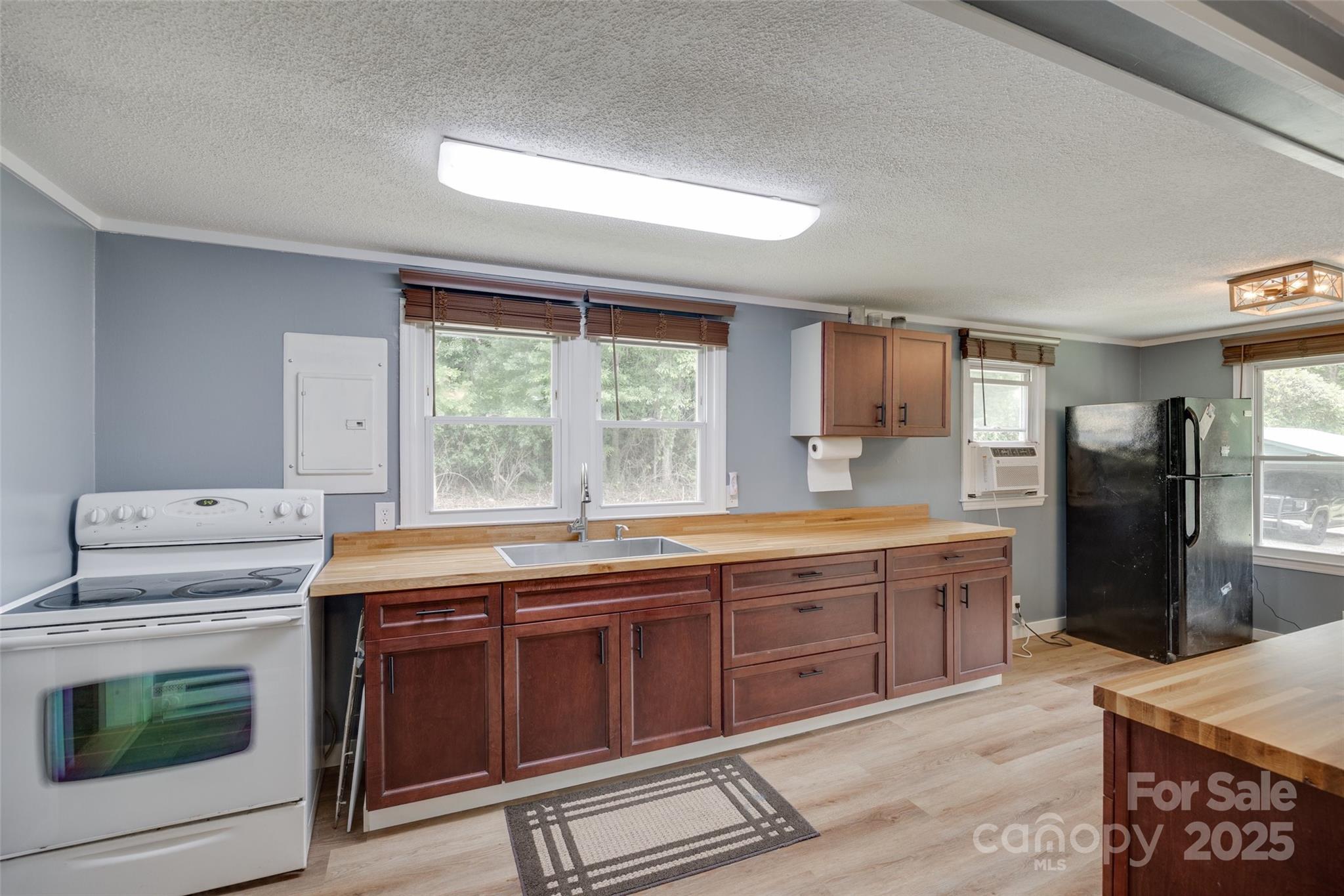 3083 State Rd S-11-54 Gaffney, SC 29340 - Photo 9 of 29 a kitchen with stainless steel appliances granite countertop a stove a sink dishwasher and a refrigerator with wooden cabinets