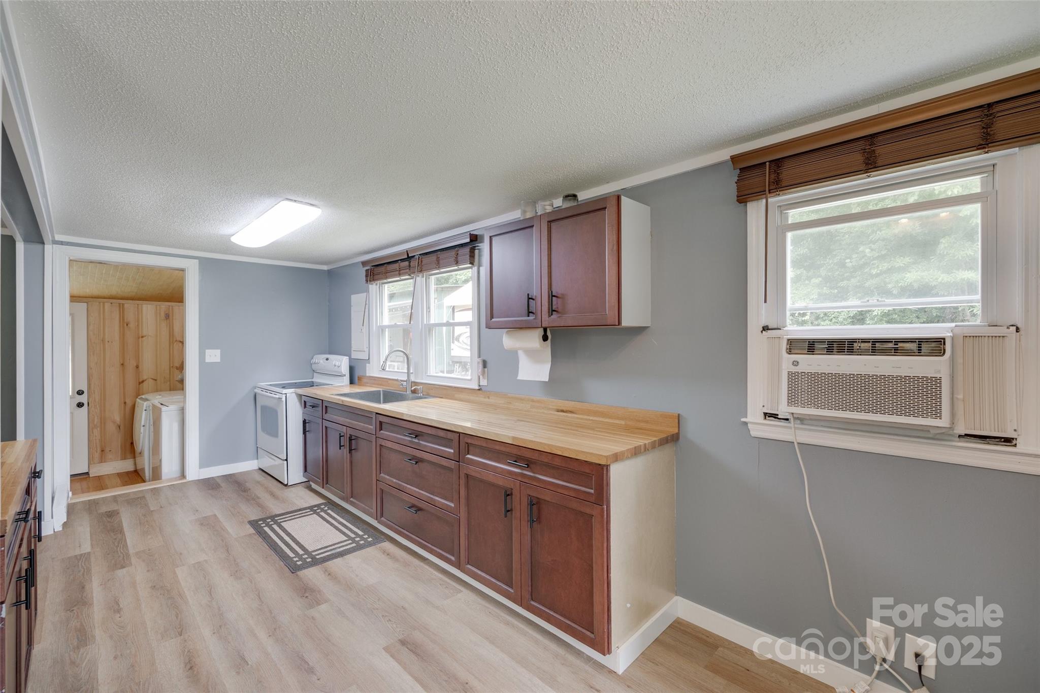 3083 State Rd S-11-54 Gaffney, SC 29340 - Photo 10 of 29 a kitchen with stainless steel appliances granite countertop a stove a sink and a refrigerator