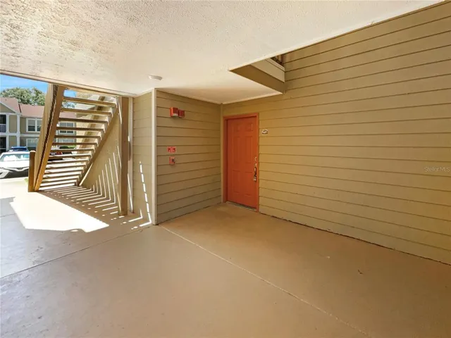 a view of an empty room with stairs