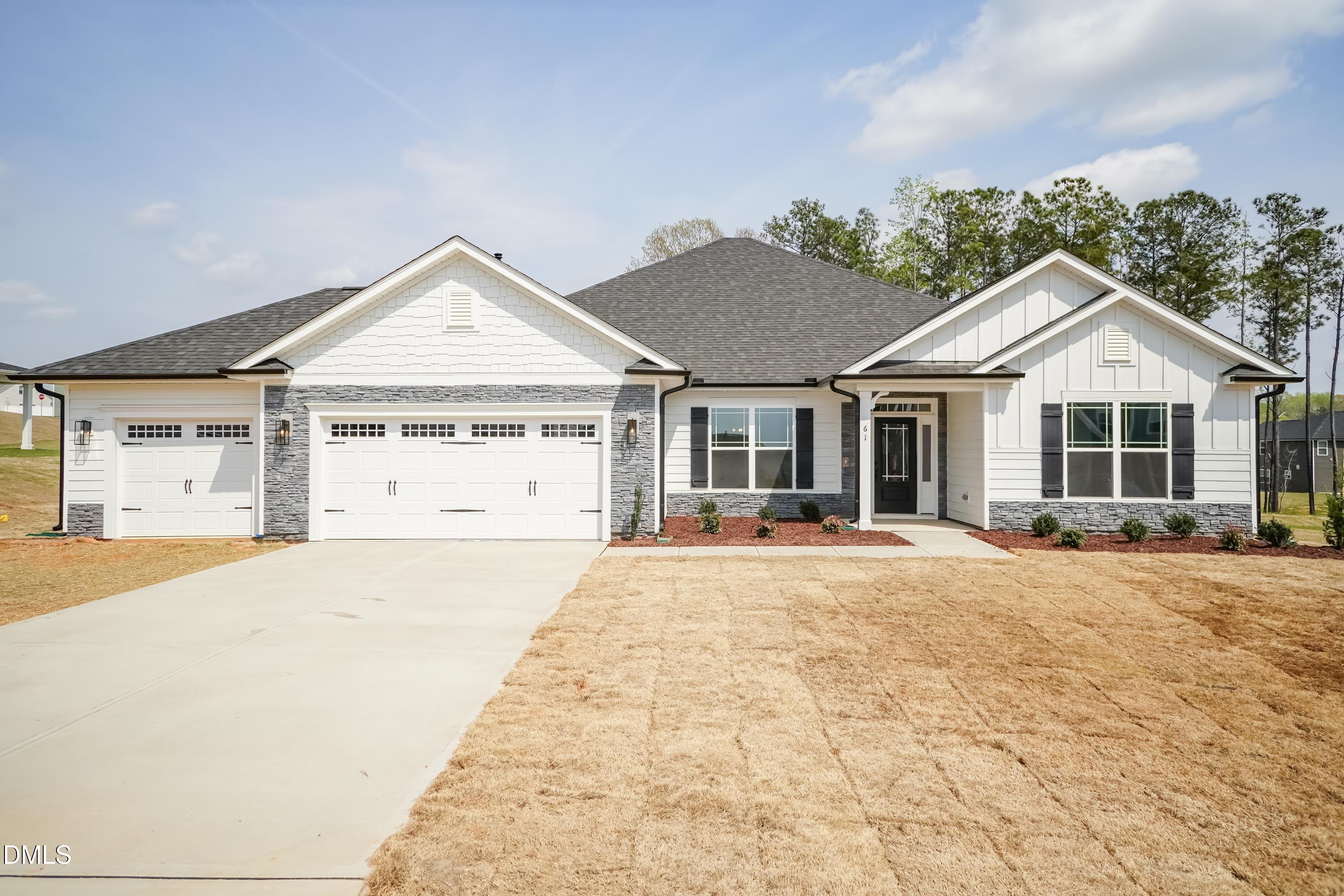 104 Galway Road Lillington, NC 27546 - Photo 1 of 40 a view of a house with a yard and potted plants