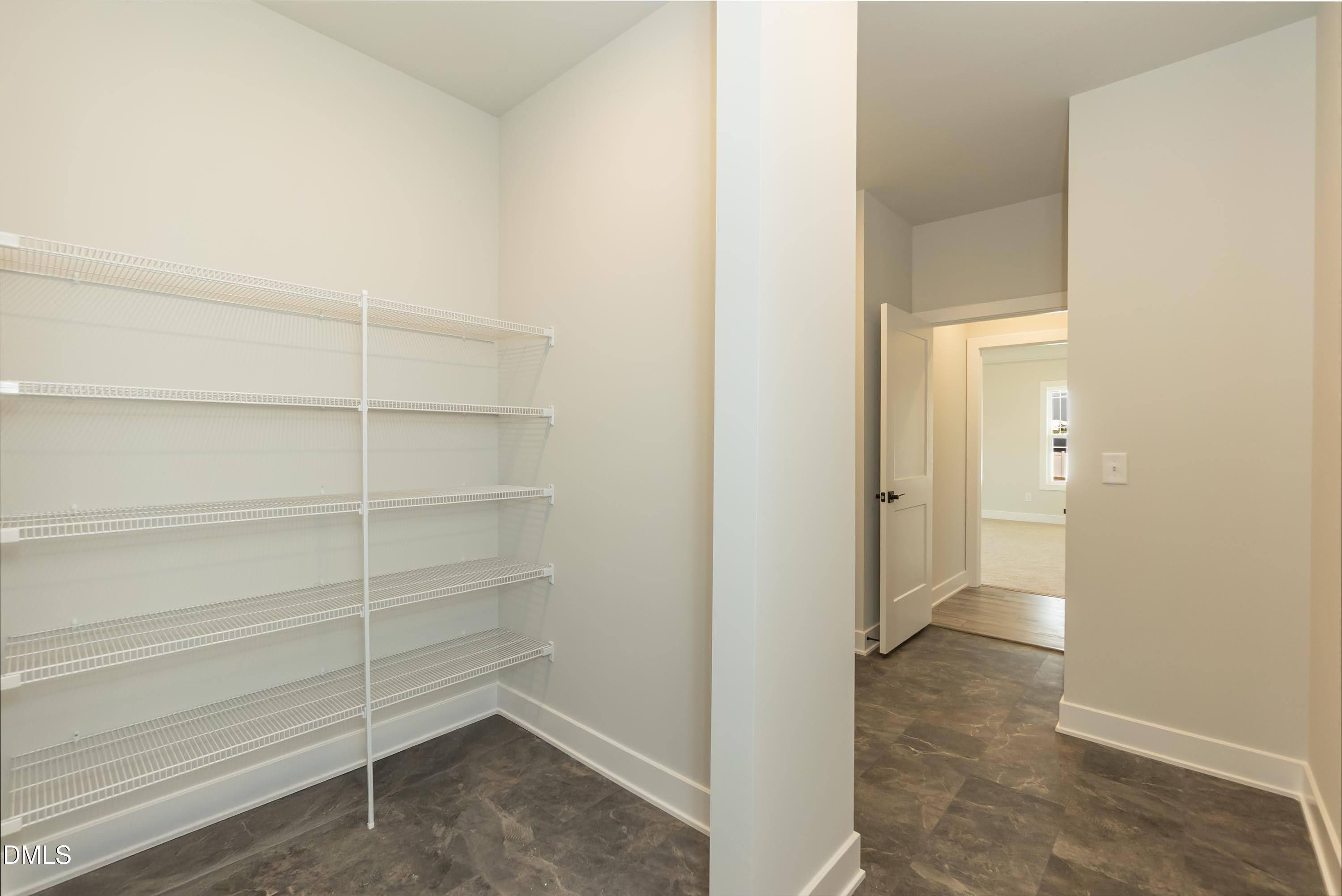 104 Galway Road Lillington, NC 27546 - Photo 14 of 40 a view of a room with shelf and racks on the wall