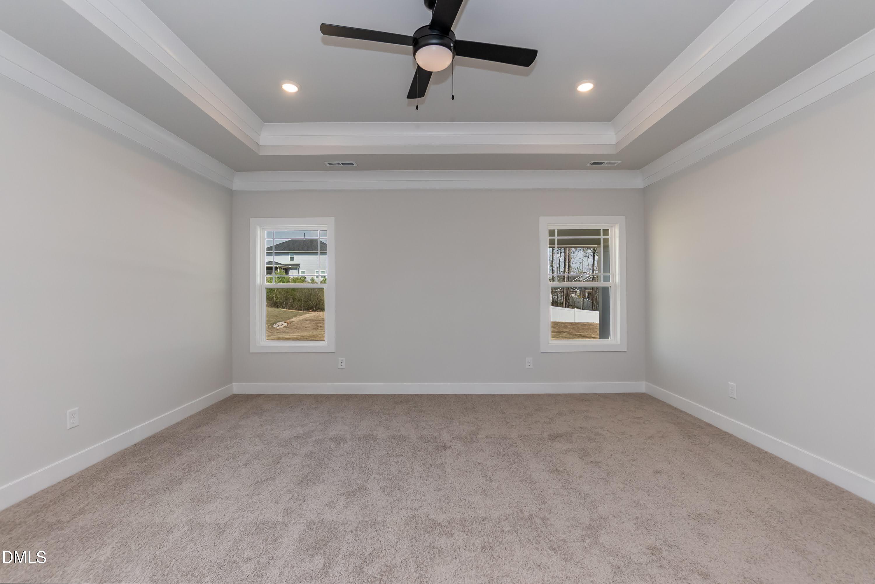 104 Galway Road Lillington, NC 27546 - Photo 20 of 40 an empty room with a window and a ceiling fan