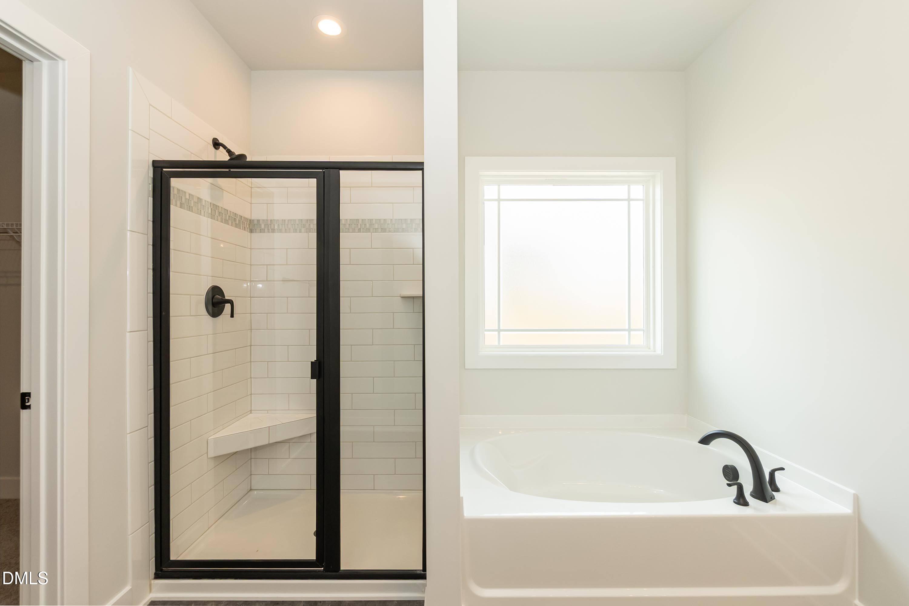 104 Galway Road Lillington, NC 27546 - Photo 23 of 40 a bathroom with a bathtub
