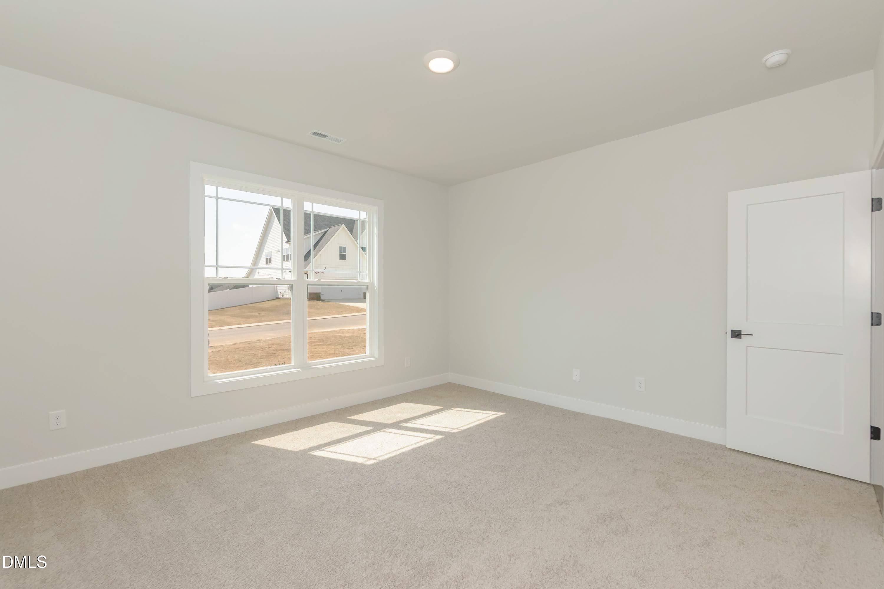 104 Galway Road Lillington, NC 27546 - Photo 25 of 40 an empty room with a window