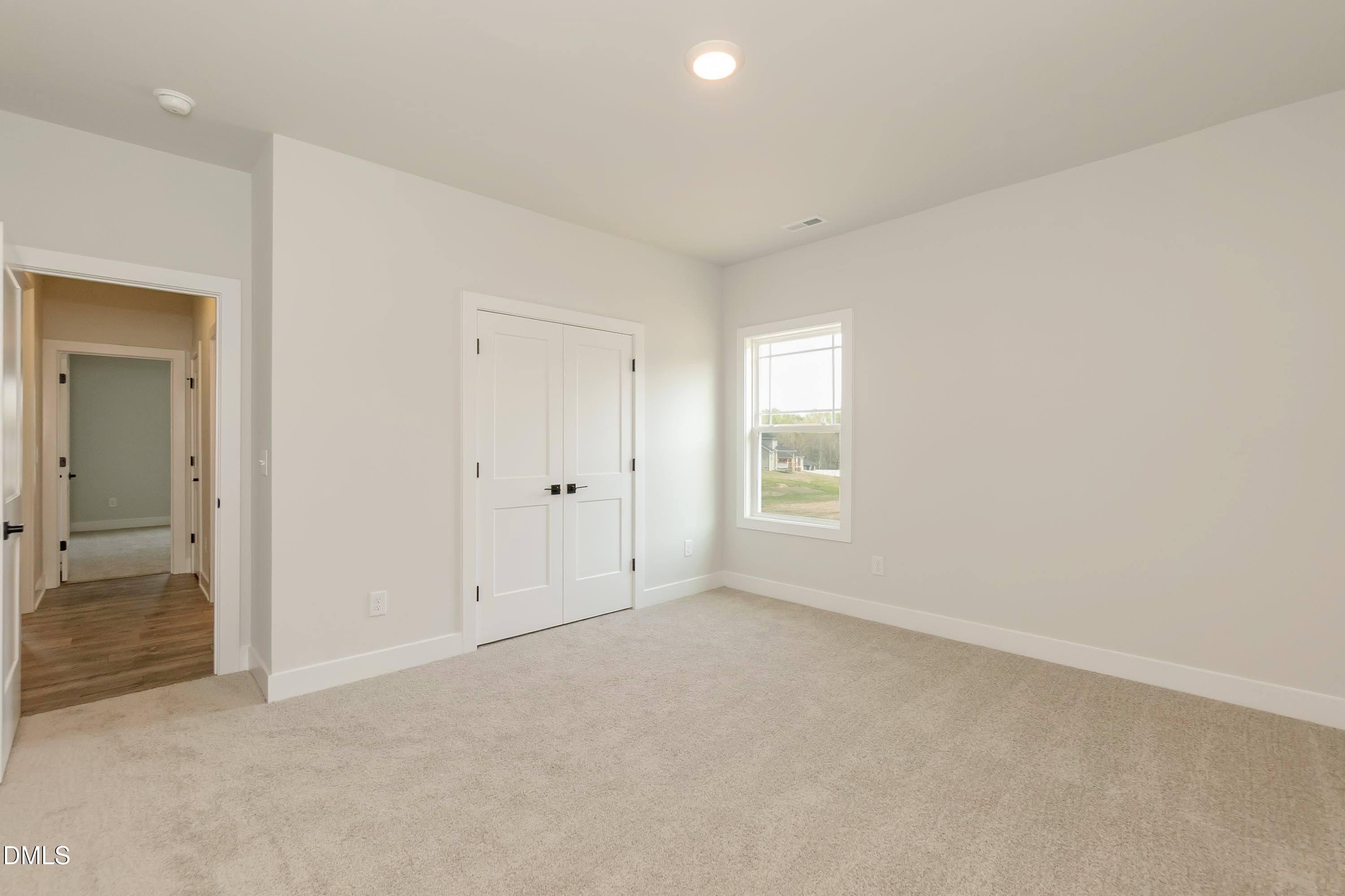 104 Galway Road Lillington, NC 27546 - Photo 27 of 40 an empty room with windows and closet