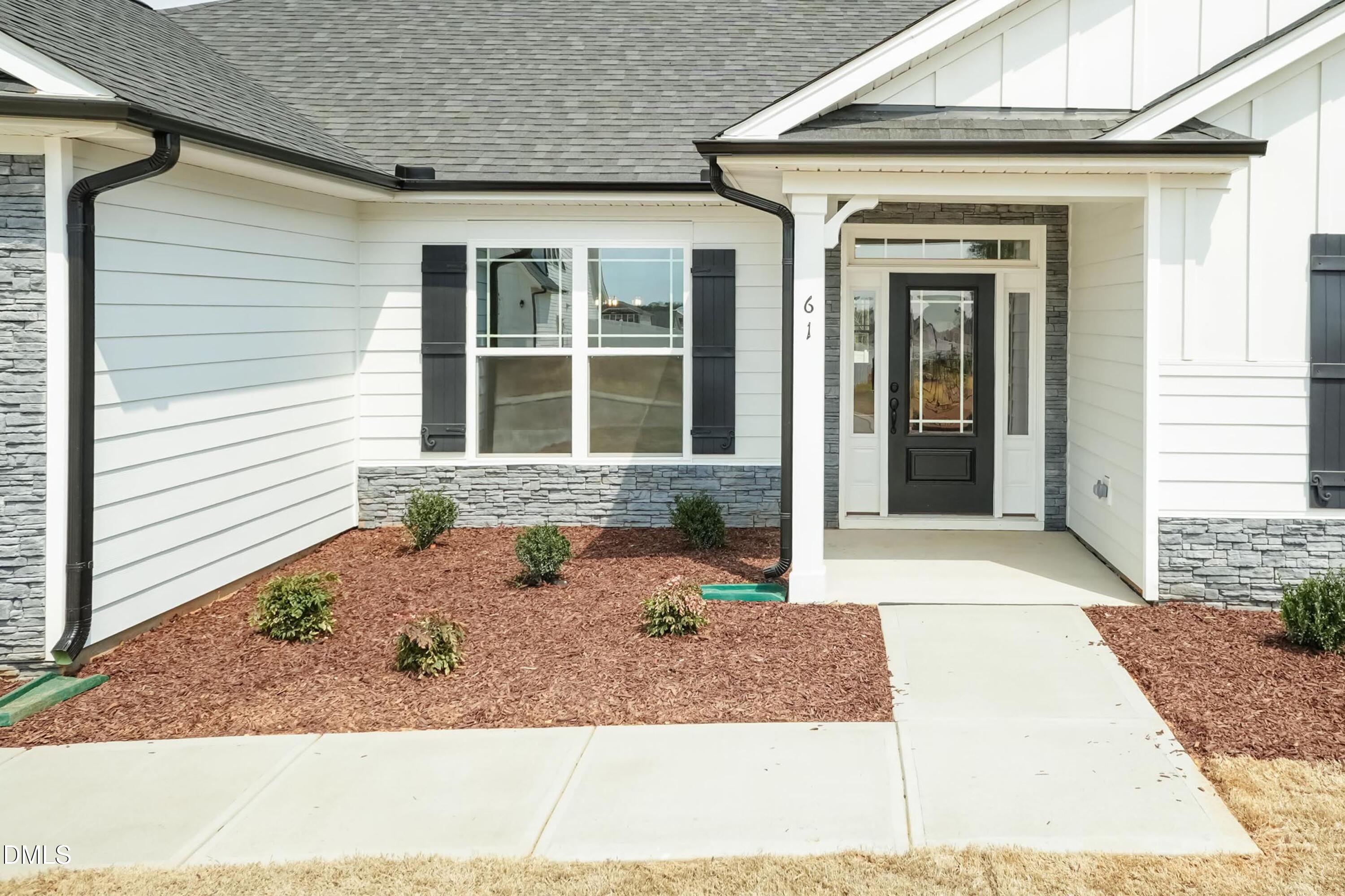 104 Galway Road Lillington, NC 27546 - Photo 6 of 40 a front view of a house with a porch