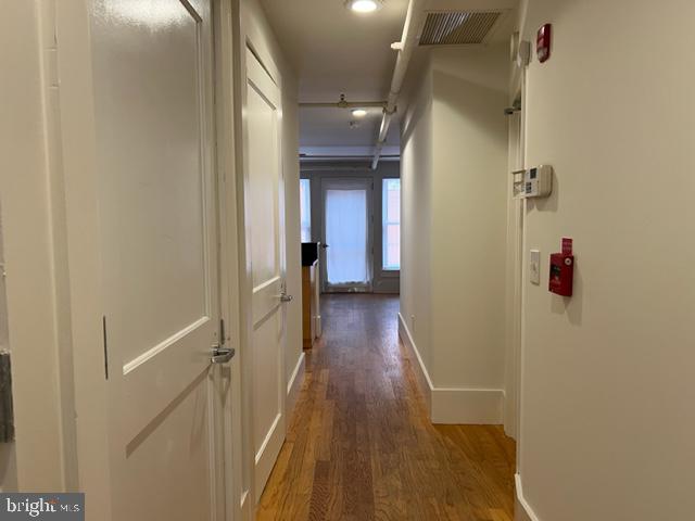 1615 Walnut Street, Unit 4 Philadelphia, PA 19102 - Photo 11 of 22 a view of a hallway with wooden floor and staircase