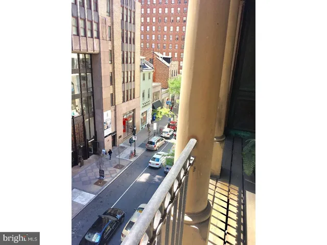 a view of a balcony with wooden floor