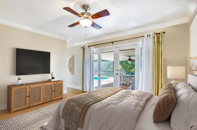 a bathroom with a granite countertop toilet a sink and a mirror