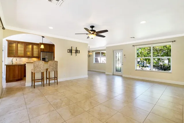 a kitchen with stainless steel appliances granite countertop a stove and a microwave