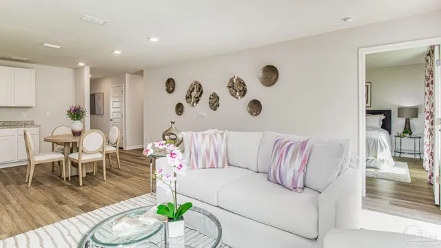 a living room with furniture and a table