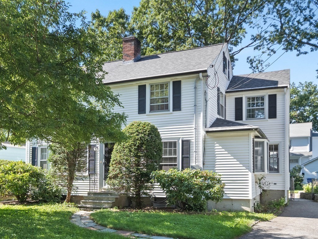 59 Harland Road Waltham, MA 02453 - Photo 1 of 39 front view of a house with a yard