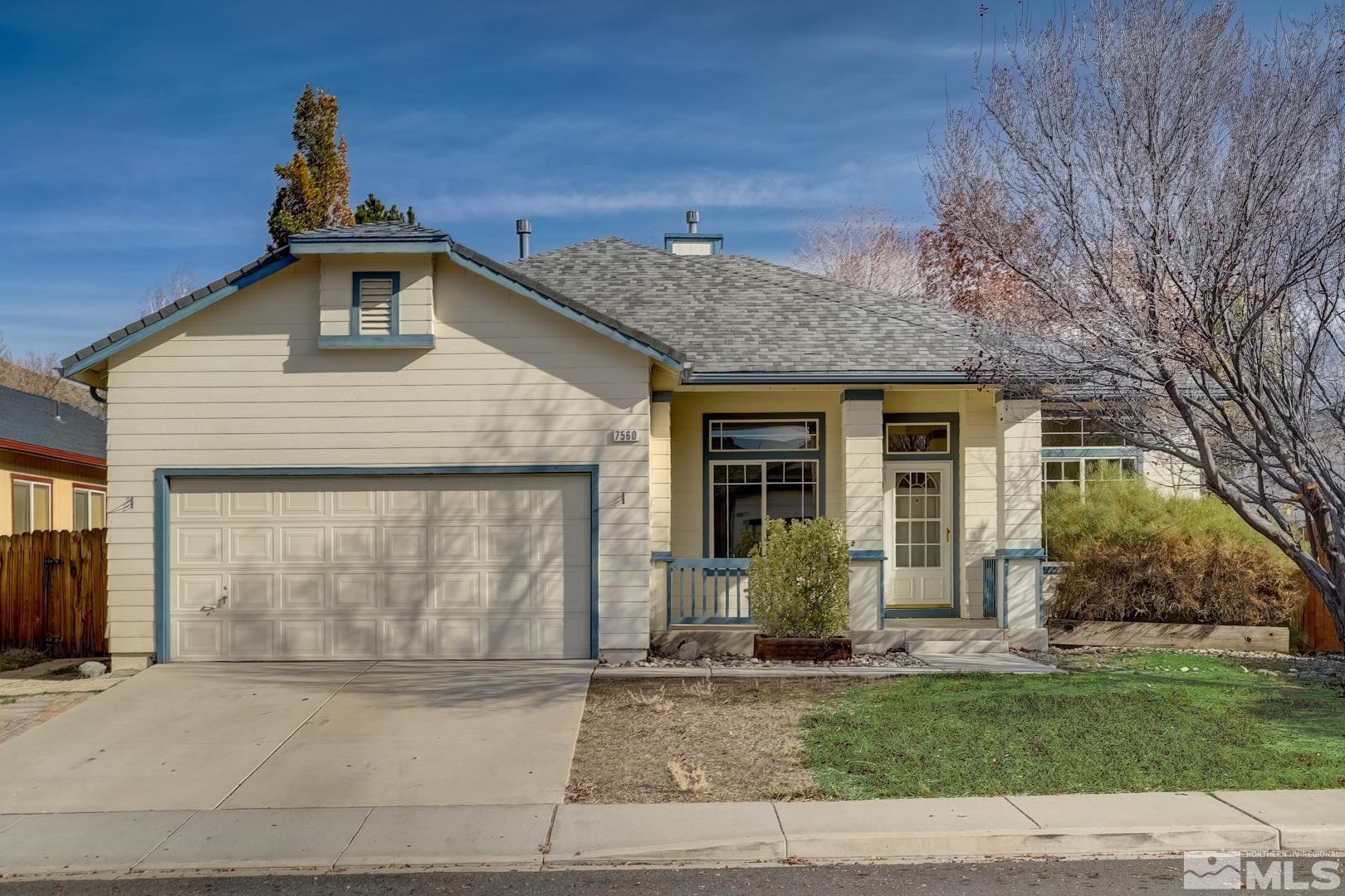 7560 Michaela Drive Reno, NV 89511 - Photo 1 of 32 a front view of a house with a garden