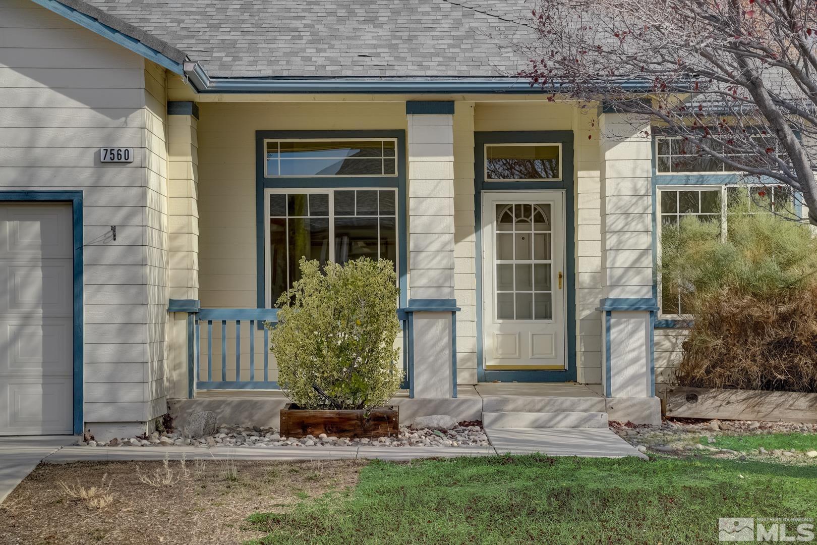 7560 Michaela Drive Reno, NV 89511 - Photo 12 of 32 a front view of a house with garden