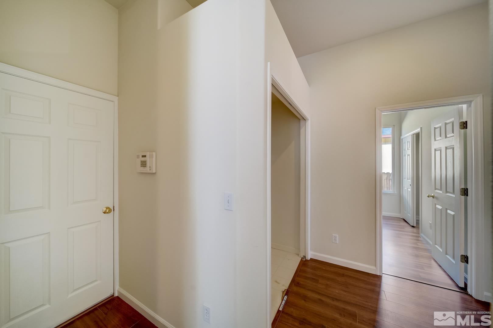 7560 Michaela Drive Reno, NV 89511 - Photo 19 of 32 a view of an entryway with wooden floor