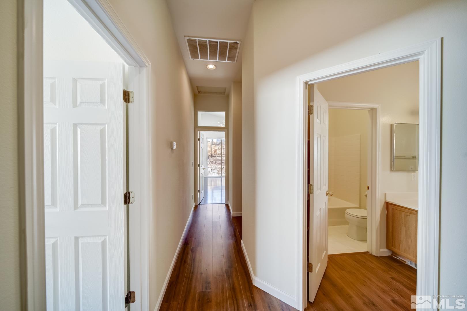 7560 Michaela Drive Reno, NV 89511 - Photo 23 of 32 a view of a bathroom with sink and wooden floor