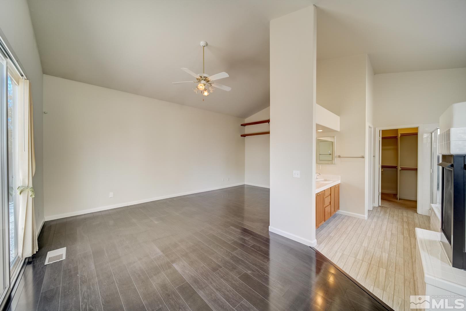 7560 Michaela Drive Reno, NV 89511 - Photo 26 of 32 wooden floor in an empty room with a kitchen