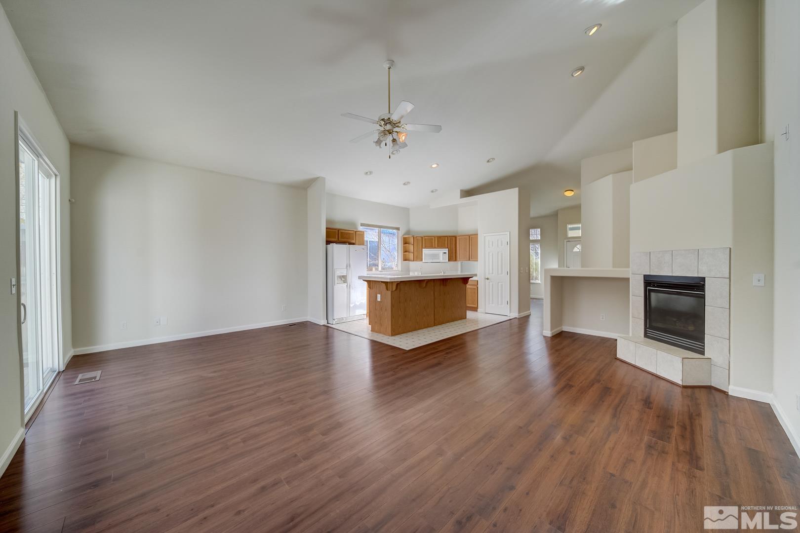 7560 Michaela Drive Reno, NV 89511 - Photo 6 of 32 a view of a kitchen with a sink and a fireplace