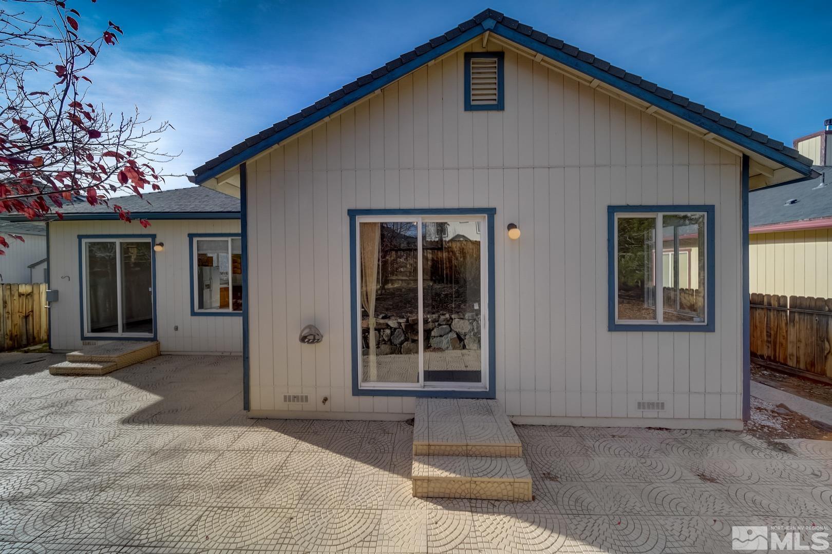 7560 Michaela Drive Reno, NV 89511 - Photo 9 of 32 a front view of a house with a yard