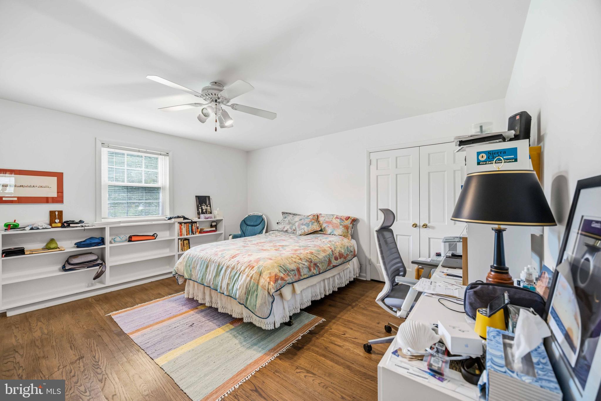 330 Bent Road Wyncote, PA 19095 - Photo 34 of 47 a spacious bedroom with a bed a couch and a window