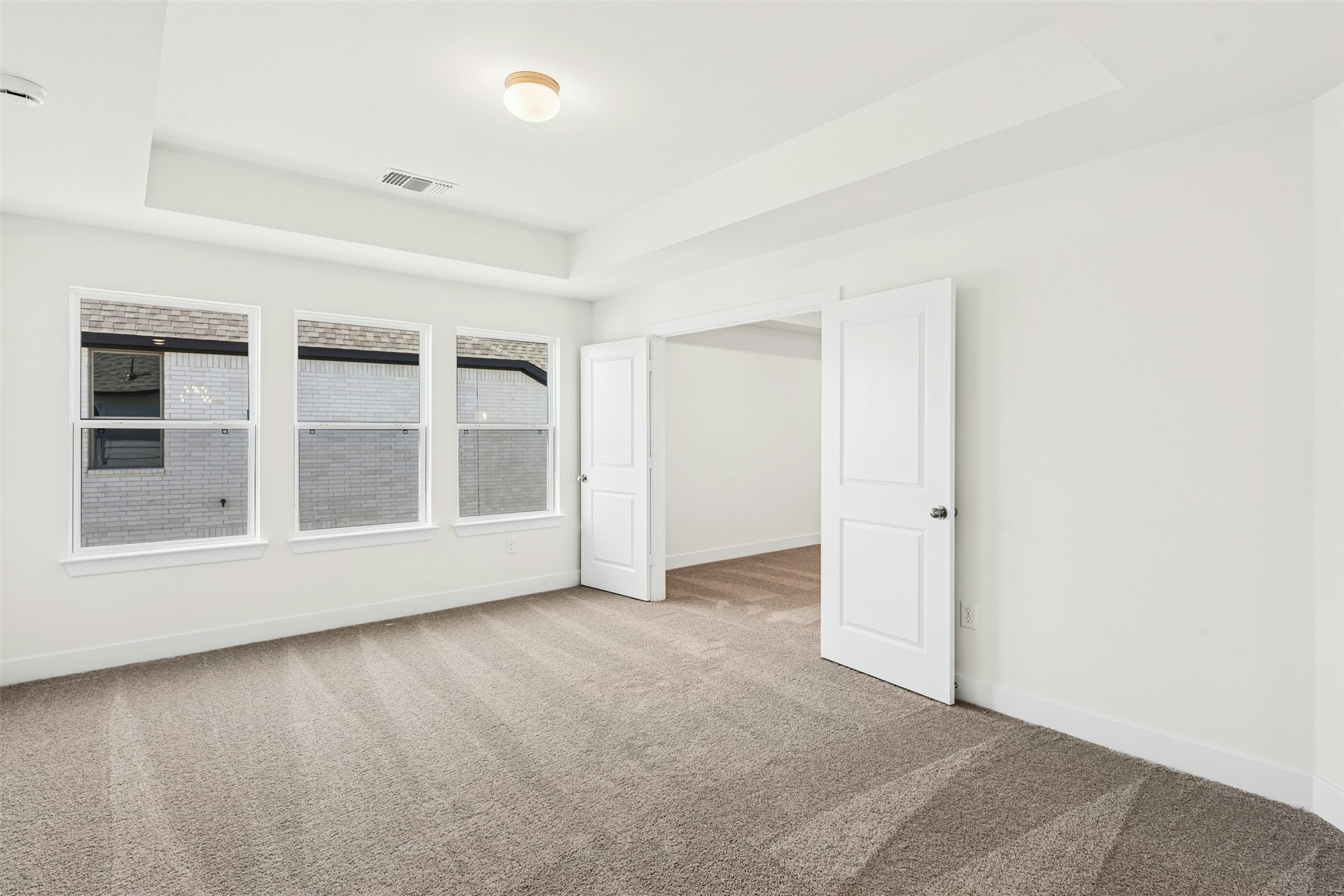 1520 Rodeo Ridge Drive Georgetown, TX 78628 - Photo 14 of 29 Carpeted spare room with a raised ceiling and baseboards