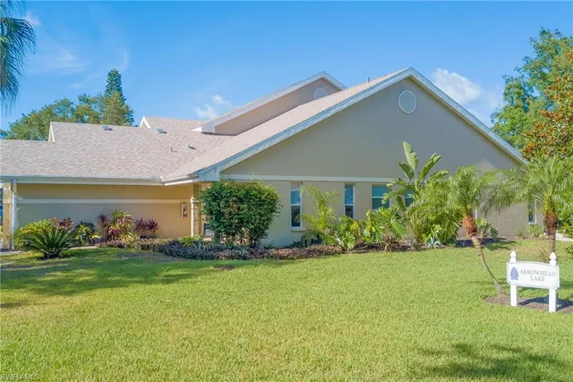 a front view of house with yard and outdoor seating