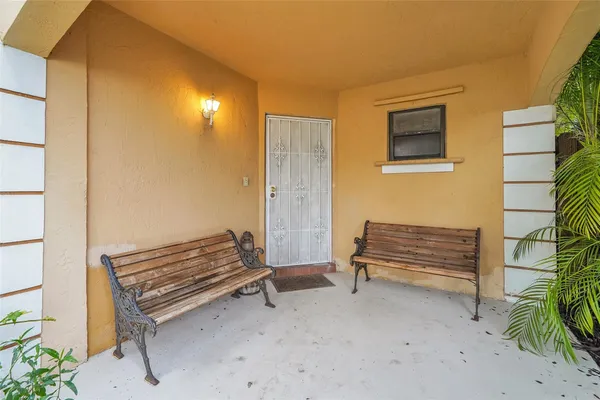 a view of a livingroom with furniture and staircase