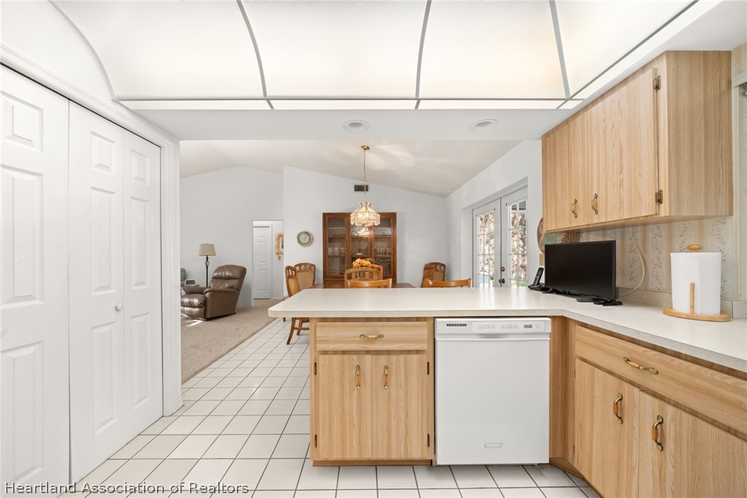 5802 Golden Road Sebring, FL 33875 - Photo 13 of 37 a kitchen with white cabinets and white appliances