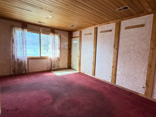 an empty room with windows