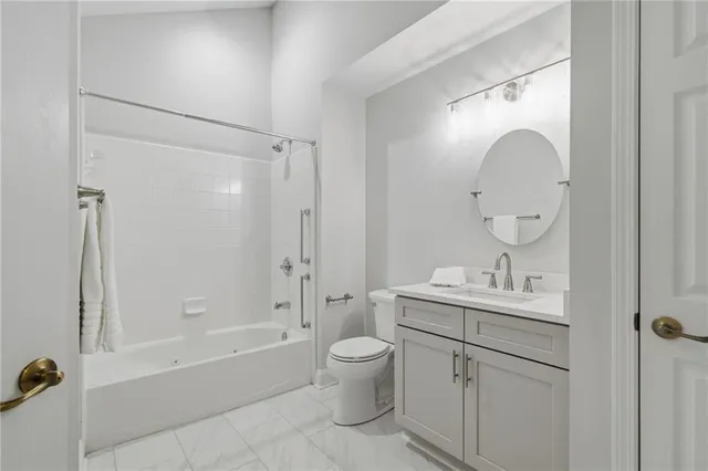 a bathroom with a toilet sink and bathtub