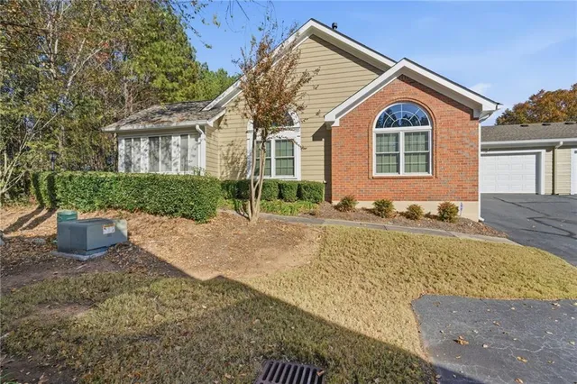 a front view of a house with garden