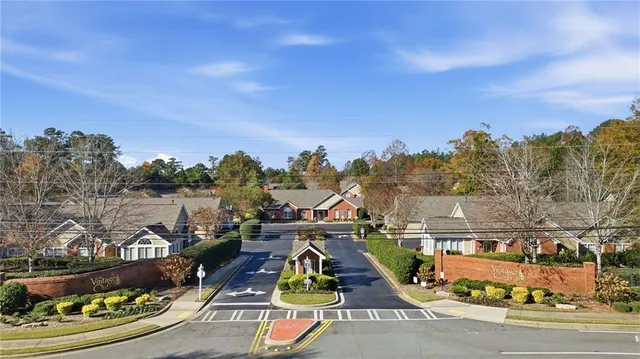 a view of a swimming pool with sitting area