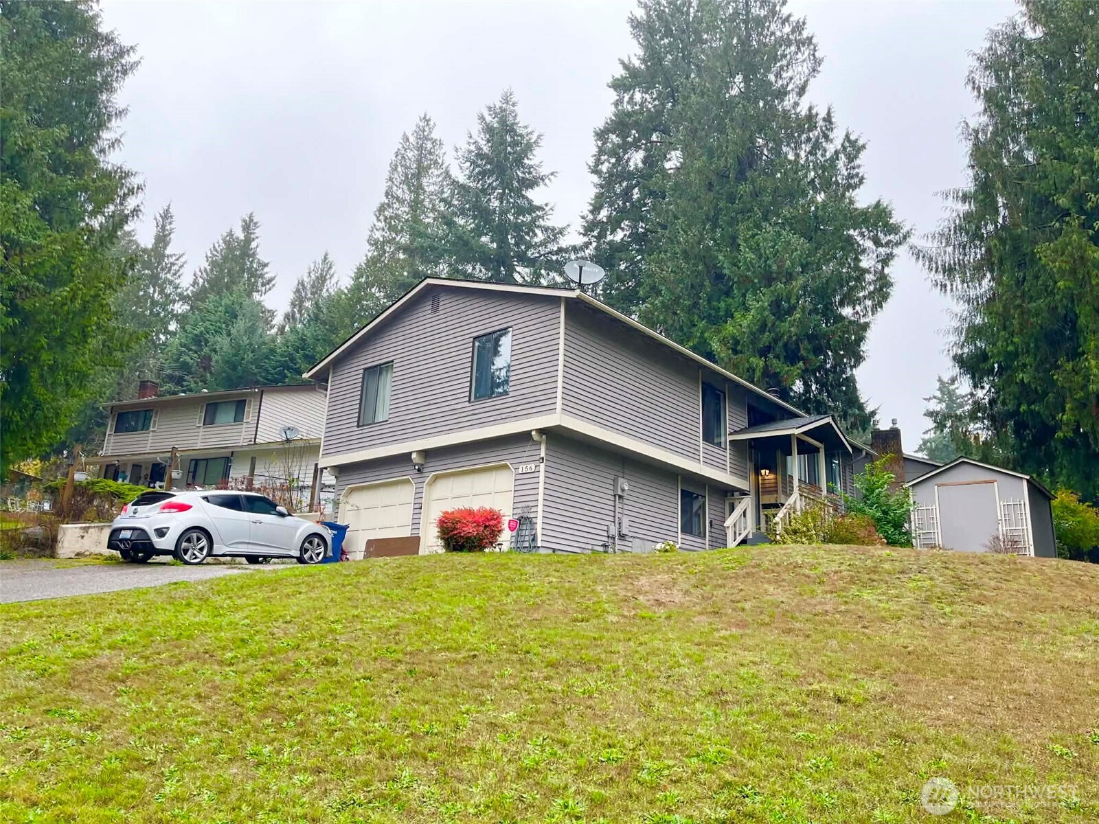 156 South 358th Street Federal Way, WA 98003 - Photo 1 of 35 a front view of house with yard and trees in the background