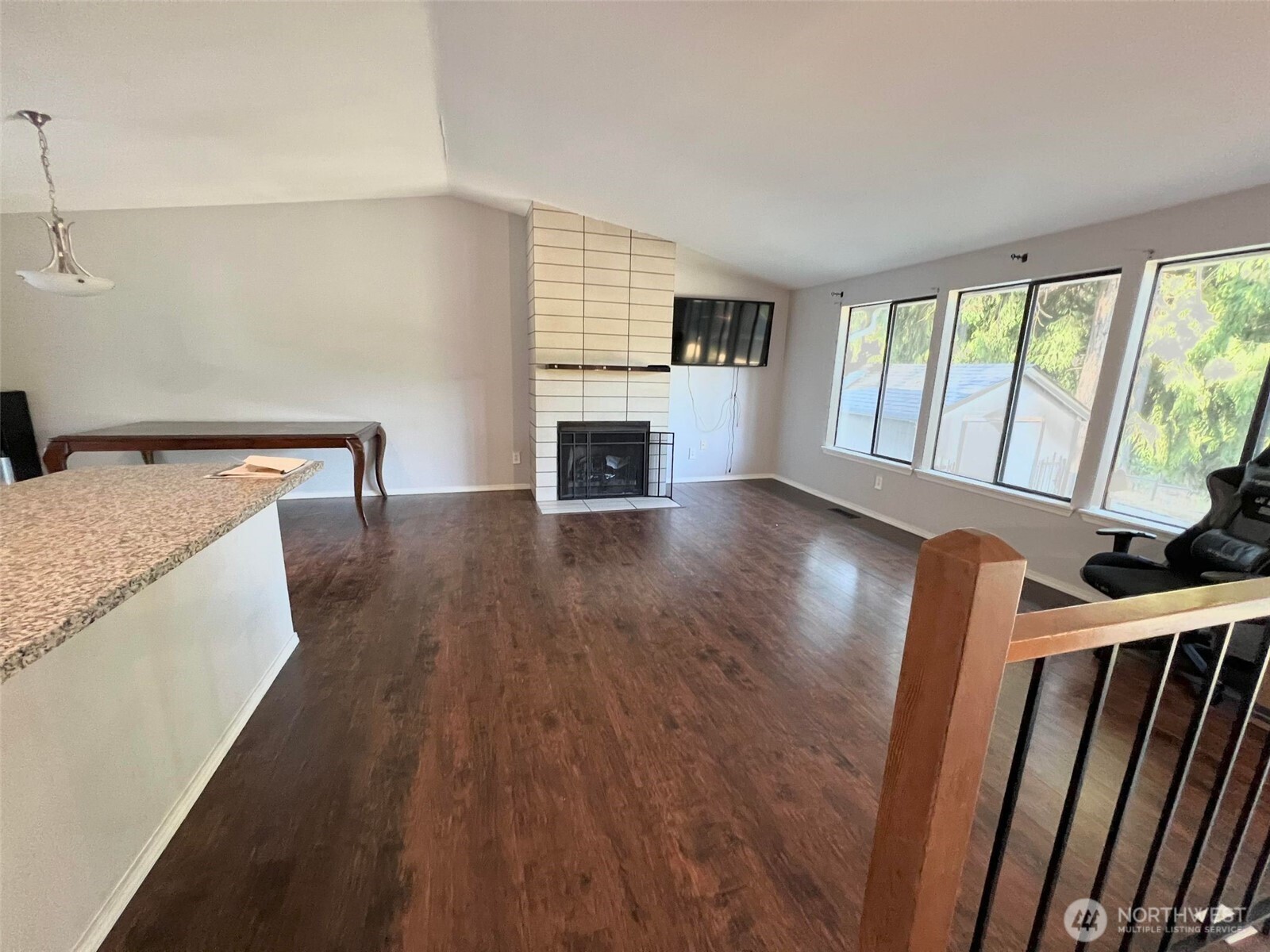 156 South 358th Street Federal Way, WA 98003 - Photo 11 of 35 a view of a livingroom with wooden floor and a fireplace