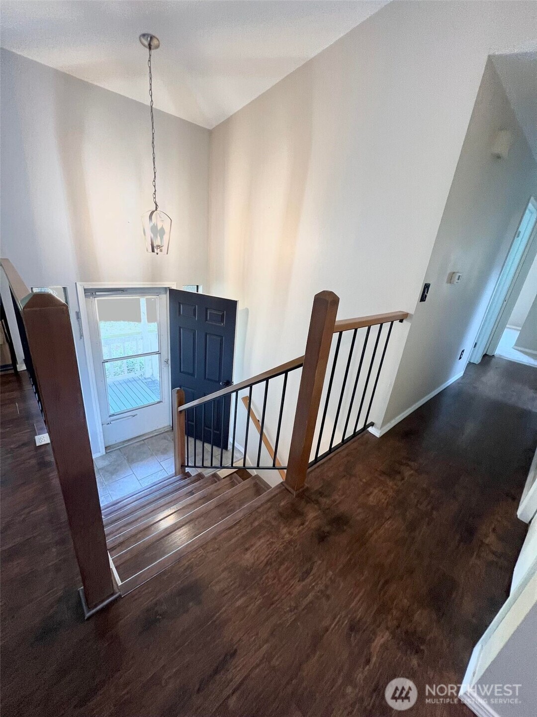 156 South 358th Street Federal Way, WA 98003 - Photo 12 of 35 a view of an empty room with wooden floor and windows
