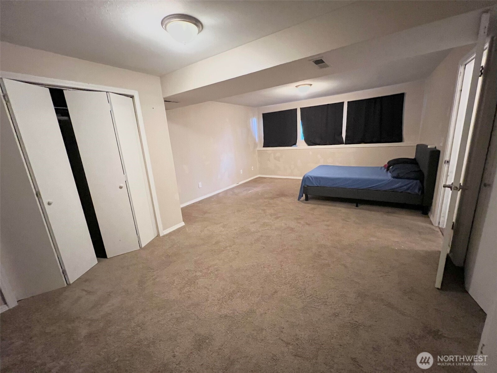 156 South 358th Street Federal Way, WA 98003 - Photo 23 of 35 a living room with a couch and a flat screen tv