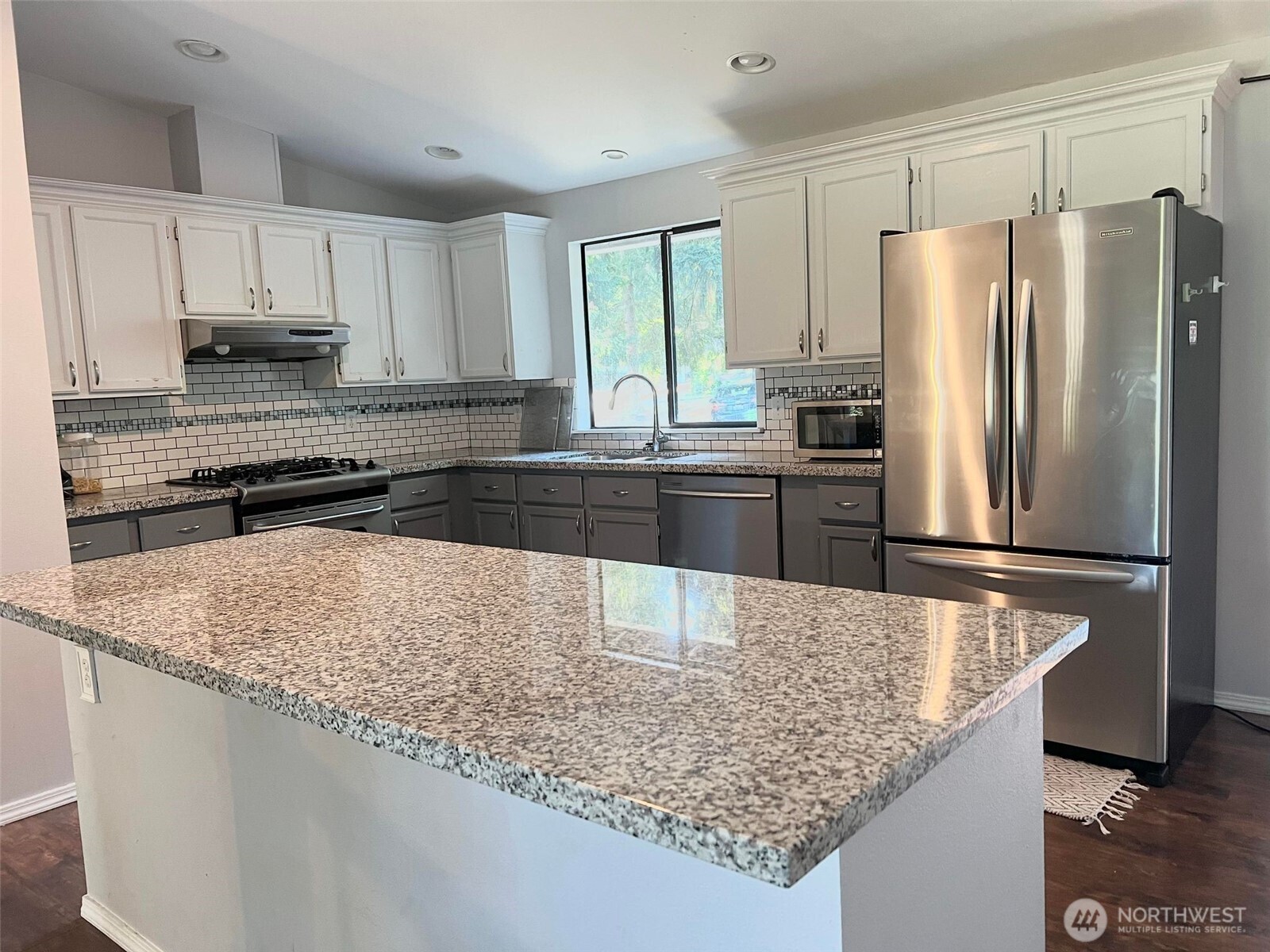156 South 358th Street Federal Way, WA 98003 - Photo 28 of 35 a kitchen with stainless steel appliances granite countertop a refrigerator a stove and a sink