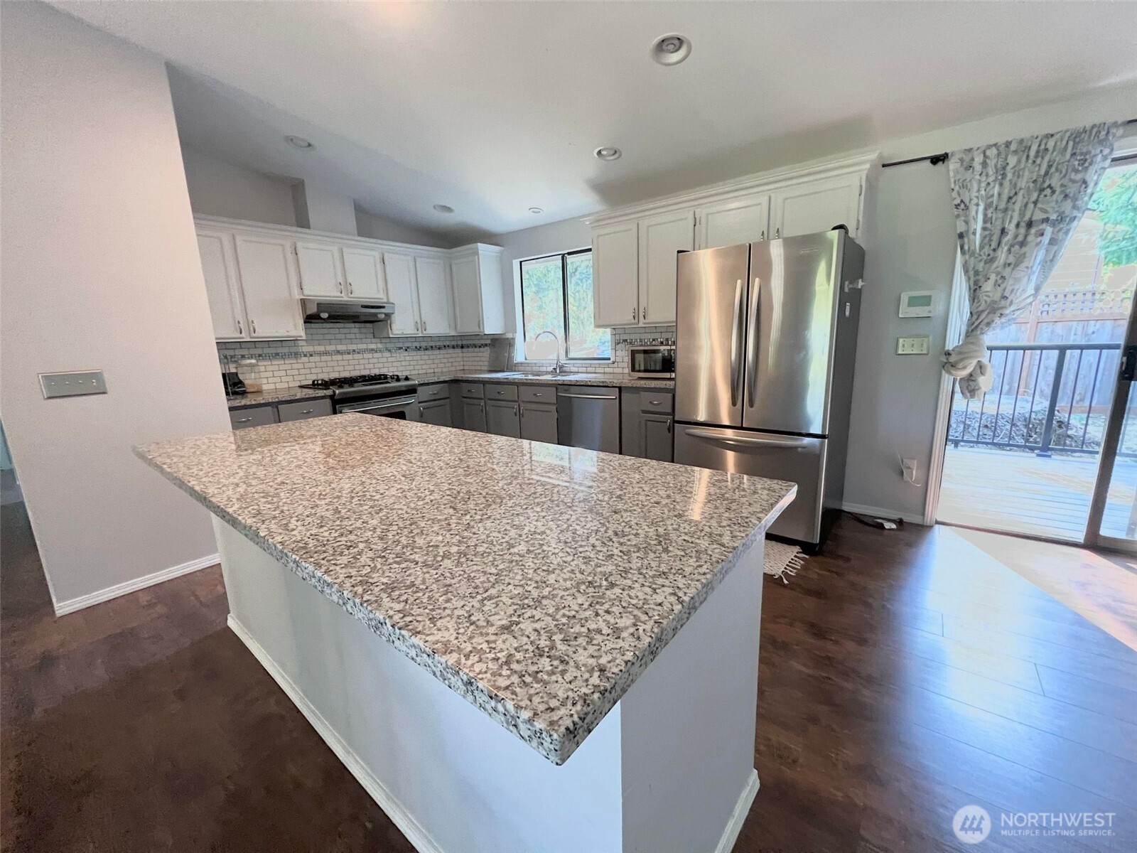 156 South 358th Street Federal Way, WA 98003 - Photo 7 of 35 a kitchen with stainless steel appliances granite countertop a refrigerator a stove and a sink