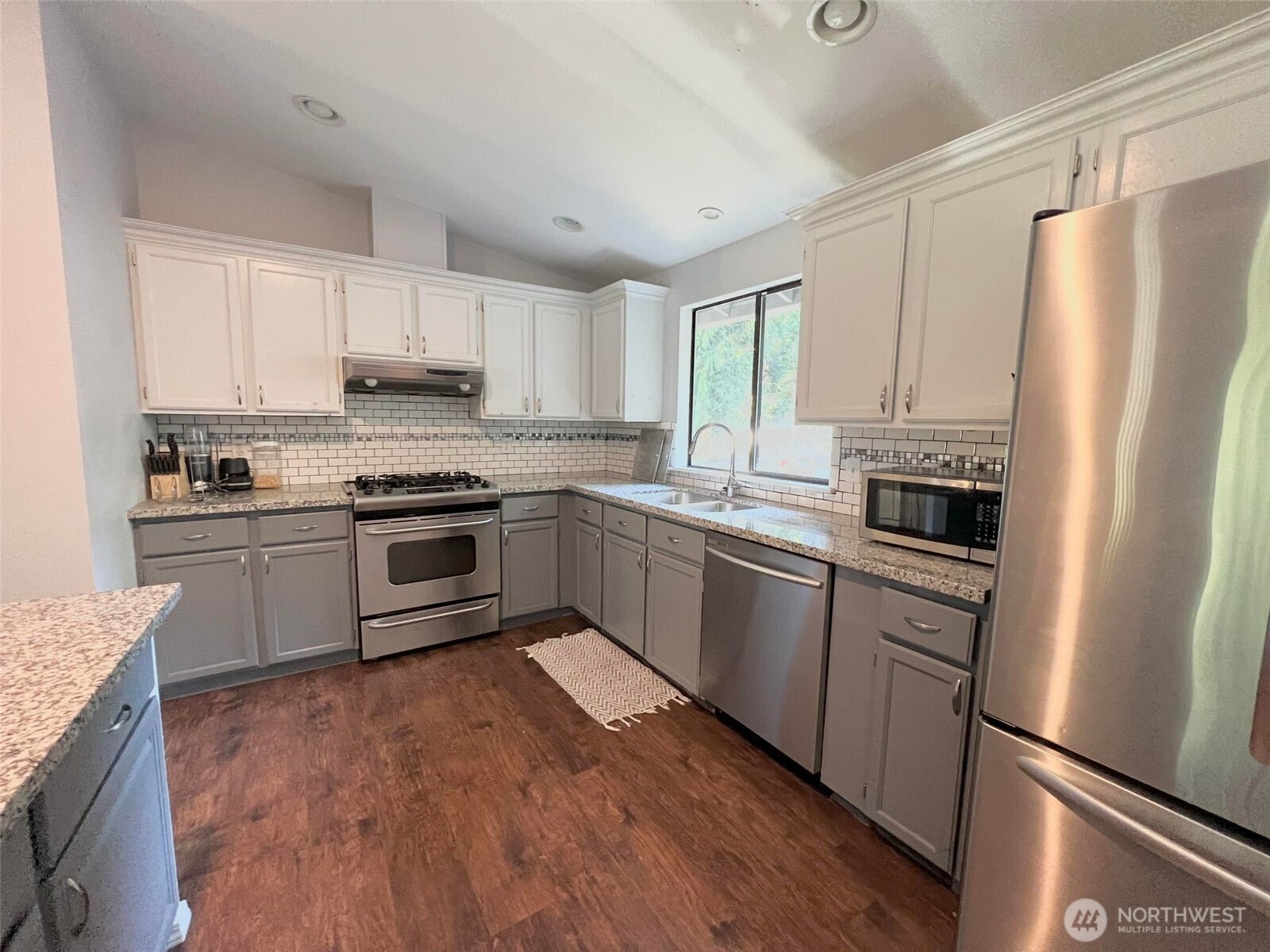 156 South 358th Street Federal Way, WA 98003 - Photo 8 of 35 a kitchen with stainless steel appliances a refrigerator sink and cabinets