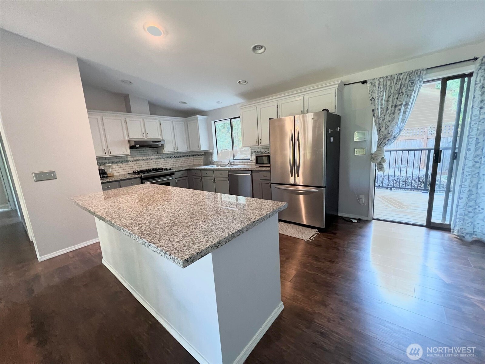 156 South 358th Street Federal Way, WA 98003 - Photo 9 of 35 a kitchen with stainless steel appliances granite countertop a refrigerator a stove and a sink